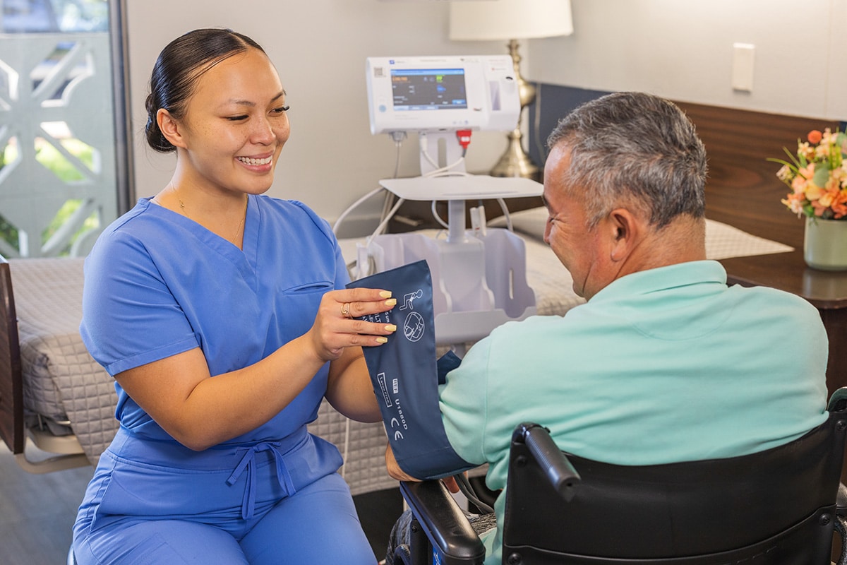 A caregiver and a resident at the Canyon Springs facility