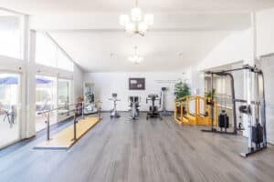 The rehab gym at Canyon Springs Post-Acute with wooden floors