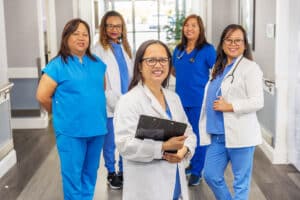 several nurses in the hallway of Canyon Springs Post-Acute