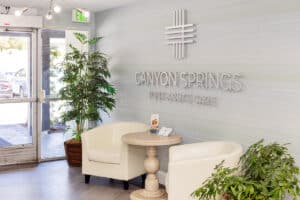 The front lobby of the Canyon Springs facility with a sign on the wall