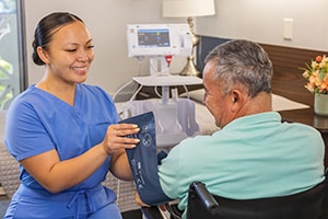 A caregiver and a resident at the Canyon Springs facility